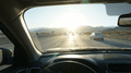 Autofahrt scene, daytime highway traffic, viewed from inside a car looking ahead.